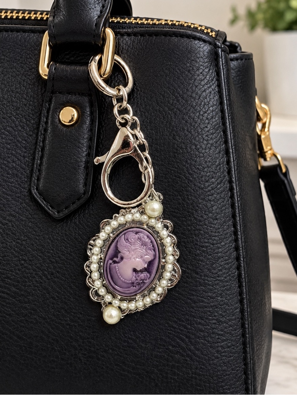 Silver tone and purple cameo purse charm keychain